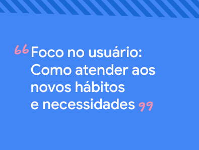 Três homens conversando, sentados em pedras, na praia.