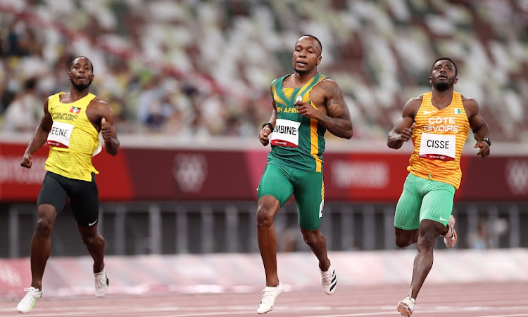 Akani Simbine (C) of Team South Africa competes in the Men's 100m Round 1 heats on day eight of the Tokyo 2020 Olympic Games at Olympic Stadium on July 31, 2021 in Tokyo, Japan.