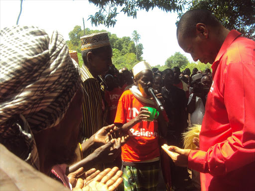 Former Garsen MP Danson Mungatana (R) is blessed by Gasa elders in Hola town on January 21 , 2013 / FILE