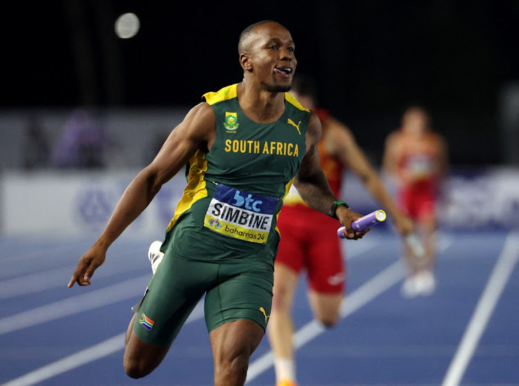 Akani Simbine crosses the line to win the 4x100m qualification heat in Bahamas on Sunday night.