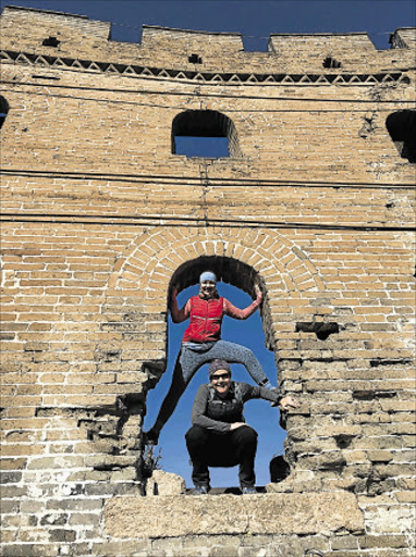 CLIMBING THE WALL: Former East Londoner Lucille van der Merwe and her running mate, Australian Kate Goode, at the Great Wall of China where they have been training for the 100km Wild Women on the Run Picture: SUPPLIED