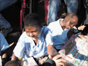 THANK YOU: Children show thier happiness after receiving gifts from Mama Angel. Pic. Unknown