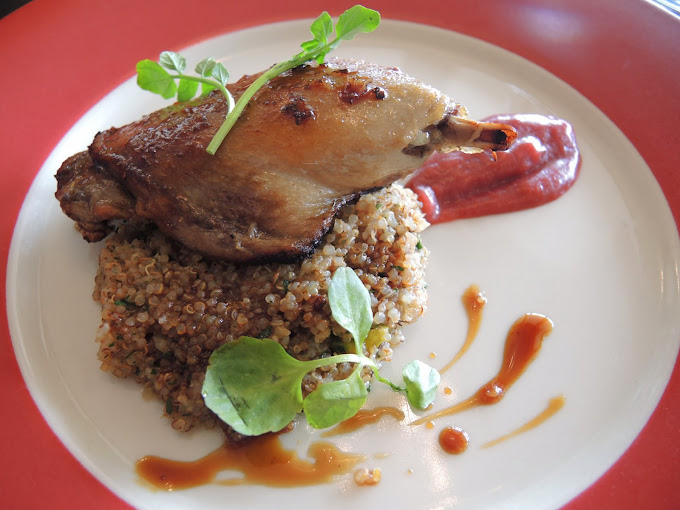 a plate of food on a red and white table