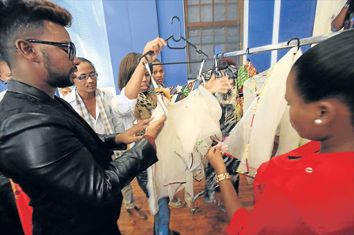 INSPIRING MIND: Fashion designer David Tlale interacting with some aspiring designers yesterday at the Eastern Cape Audio Visual Centre, where he was conducting a workshop Picture: SINO MAJANGAZA