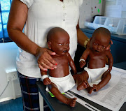 Forensic nurse Beatrice Mongale demonstrating how child survivors of sexual violence may communicate about their ordeal using dolls at the Kgomotso Care Centre in Boitekong township in Rustenburg. 