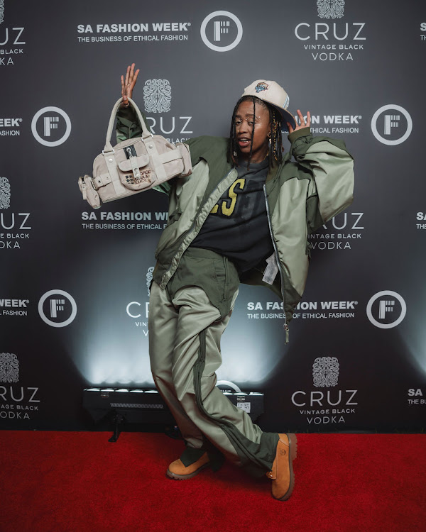 Lulo Adiba strikes a pose on the red carpet.