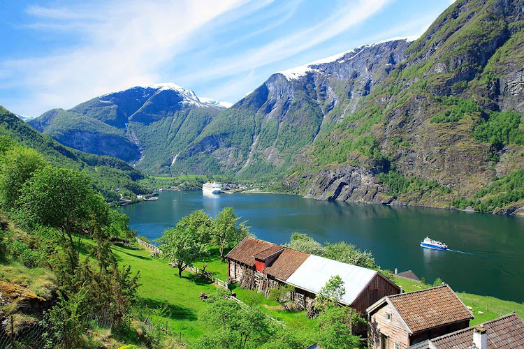 Traditional homes line the shores of Aurlandsfjord in Norway.