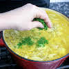 Thumbnail For Sprinkling Fresh Parsley Into The Soup.