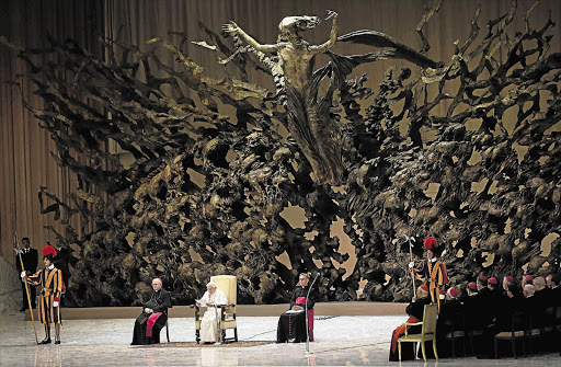 Pope Benedict XVI in the Paul VI hall at the Vatican in Italy in front of 'The Resurrection' by Pericle Fazzini. File photo.