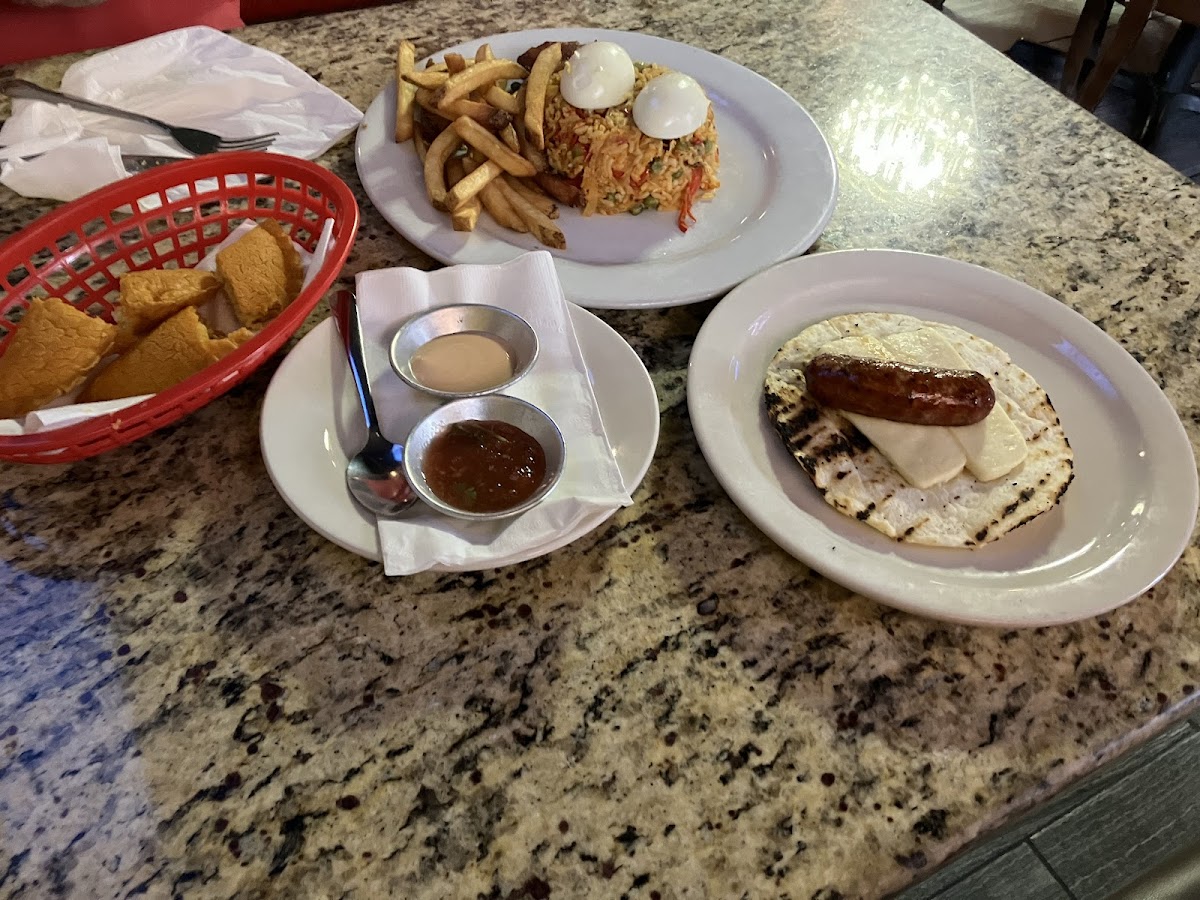 Empanadas (Chicken and Cheese), Chorizo con Arepita (Chorizo with cheese and corn tortilla), Arroz con Pollo (Yellow Rice and Chicken served with plaintains and fries)