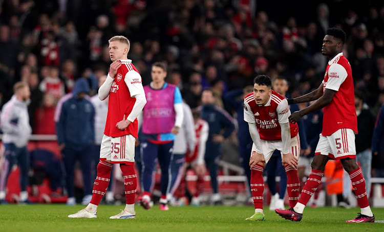 Arsenal players Oleksandr Zinchenko, left, Gabriel Martinelli, centre, and Thomas Partey dejected after the UEFA Europa League round of 16 second leg loss to Sporting Lisbon at the Emirates Stadium in London.