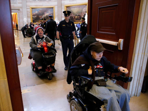 US Capitol police arrest demonstrators in wheelchairs protesting against the AHCA health care bill put forward by President Trump and Congressional Republicans as several dozen protesters are taken into custody after refusing to leave the rotunda of the U.S. Capitol in Washington, US, March 22, 2017. /REUTERS