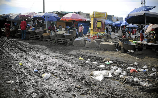 COMING TO TERMS: Soweto market in Lusaka, Zambia, where memories of the strictures that accompanied the last IMF loan are still painful.