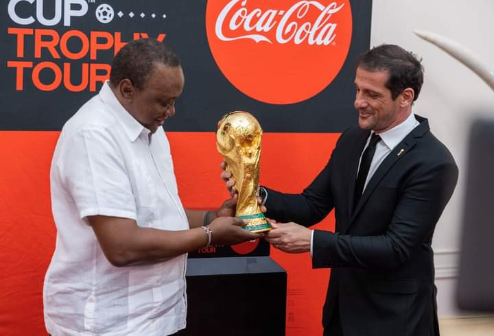 President Uhuru Kenyatta with Brazilian star Juliano Belletti with the FIFA World cup trophy at State House on Thursday, May 26, 2022.