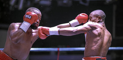 Sibusiso Zingange, right, exchanges leather with Ashley Dlamini in 2016 for the vacant ABU title in Boksburg, which Zingange won.