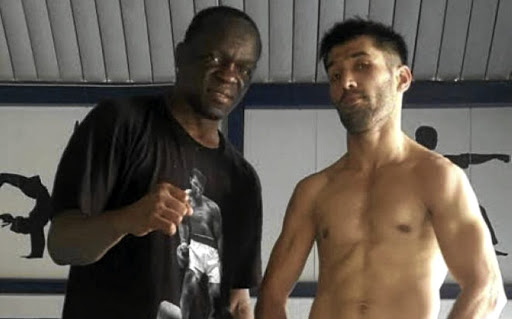 Trainer Jeff Mayweather with his charge Muhammad Waseem. /supplied