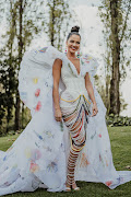 Note how the beaded strands of the skirt of Miss Universe SA, Natasha Joubert's, national costume reference the colours of the SA flag.