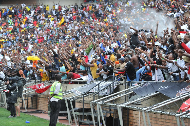 Orlando Pirates fans celebrate the opening goal during the MTN8 2nd leg semi final match against Mamelodi Sundowns at Peter Mokaba Stadium on October 22.