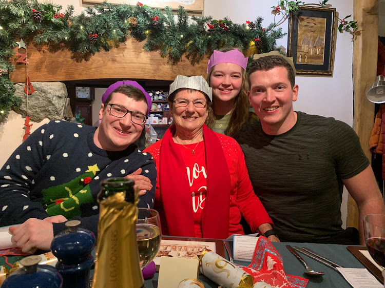 Joy Lloyd with her Welsh grandchildren Ben, Megan and Sam who she hasn't seen in two years because of the pandemic. Their plans for a family Christmas this year have been scuppered by the Omnicon travel ban.