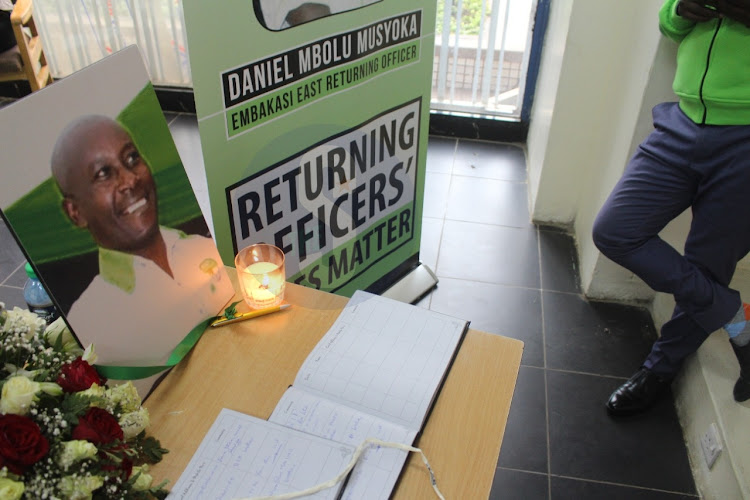 Portrait of Daniel Musyoka, a returning officer whose body was found in Oloitotok is seen at IEBC headquarters, Nairobi on August 25, 2022. IEBC officials and activists on Thursday held a demonstration condemning attacks on election officials during general elections.