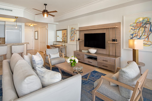 Modern living room with sofa and armchairs - Prestige apartment / penthouse for sale in Grace Bay, 2 bedrooms