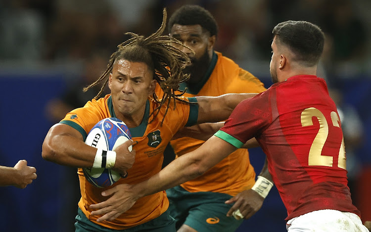 Australia's Issak Fines-Leleiwasa (left) and Portugal's Joris Moura in action in their Rugby World Cup pool C match against Portugal in Saint Etienne, France on Sunday.