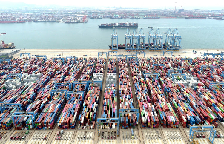 An aerial view shows containers and cargo vessels at the Qingdao port in Shandong province, China. Picture: CHINA DAILY via REUTERS