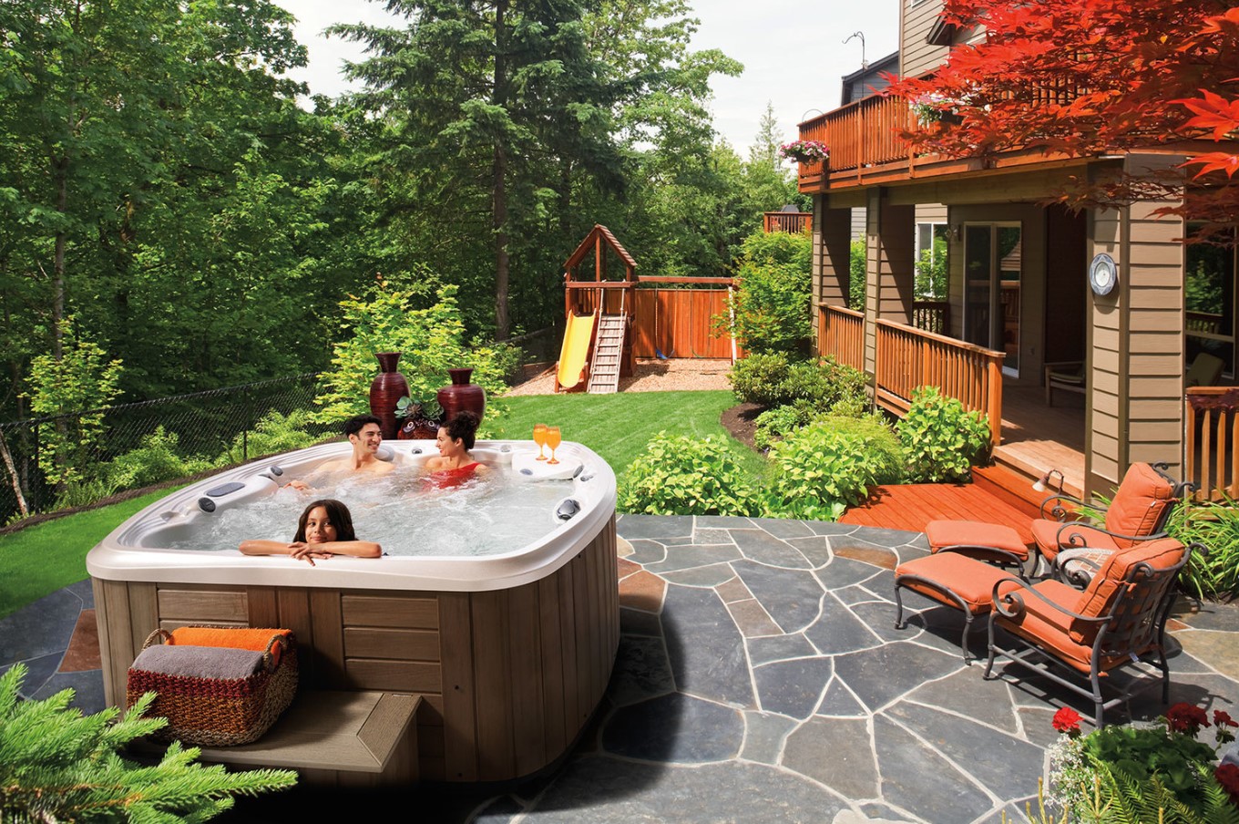 A Marquis spa is tastefully decorated using our hot tub landscaping tips.