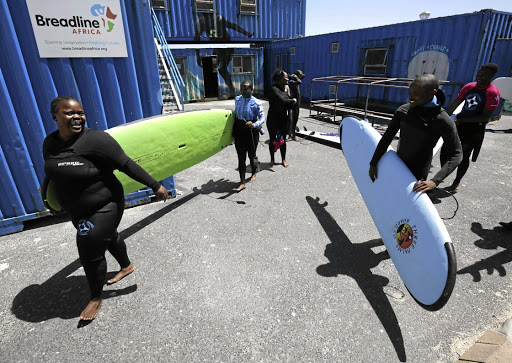 It takes Annelissa Mhloli 20 minutes to get into her wetsuit, she says. Then she's ready to lead her young charges from Khayelitsha into the sea at Muizenberg to discover the joy of surfing.