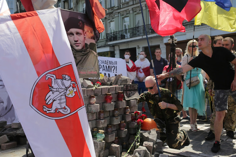 Activists attend a rally in support of Belarusian anti-government movement in Kyiv, Ukraine June 20, 2021.