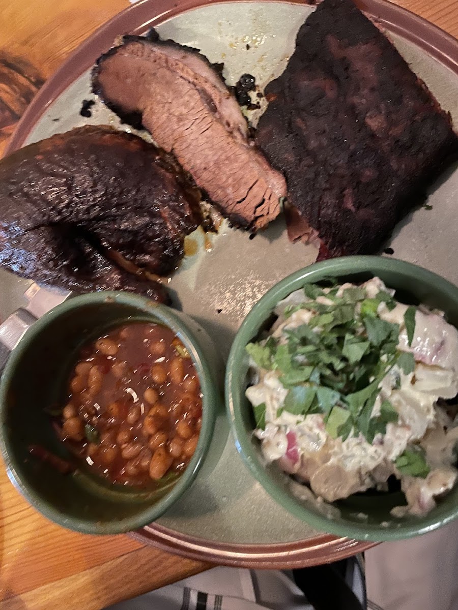 Brisket, ribs, and chicken with two sides (beans and potato salad)