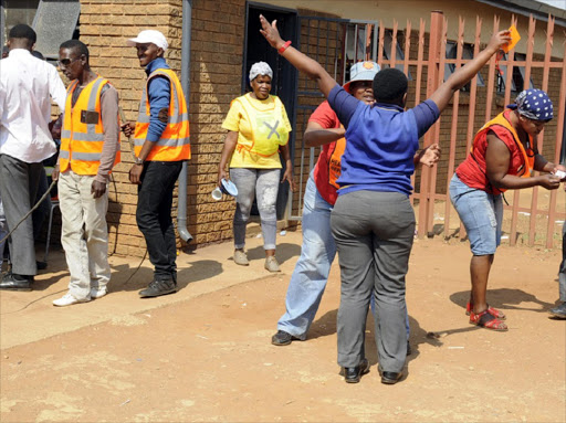 September 14, 2016. Community patrol team search pupils as they arrive for school at Badirile High School in Khutsong, Carletonville, west of Johannesburg. Pic: Peter Mogaki. © Sowetan