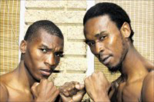 SQUARING UP: Godfrey Nzimande, left, with Zolani 'Old Bones' Marali during a medical check up at Boxing South Africa's office in Nasrec, Johannesburg yesterday. Pic. Antonio Muchave. 28/04/2008. © Sowetan.