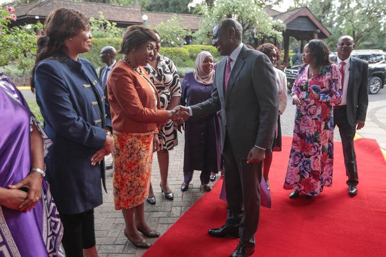 President William Ruto exchanges pleasantries with former Kitui Governor Charity Ngilu during the launch of Council of Governors Women caucus on March 7, 2024.