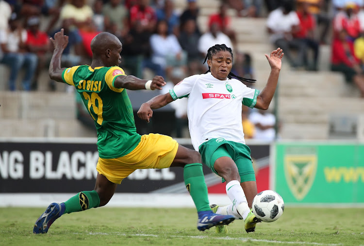 Siyethemba Sithebe of AmaZulu tackled by Nkosinathi Sibisi of Golden Arrows during the Absa Premiership 2018/19 match between Golden Arrows and AmaZulu at the Suger Ray Xulu Stadium, Clermont ,14 April 2019.