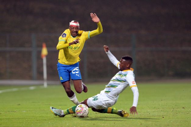 Khuliso Mudau of Mamelodi Sundowns and Nqobeko Dlamini of Golden Arrows players during the DStv Premiership match at Tuks Stadium on September 10.