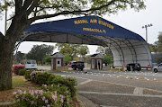 The main gate at Naval Air Station Pensacola is seen on Navy Boulevard in Pensacola, Florida, U.S.. The station was the scene of a shooting which played out over two floors in a classroom building at the base.