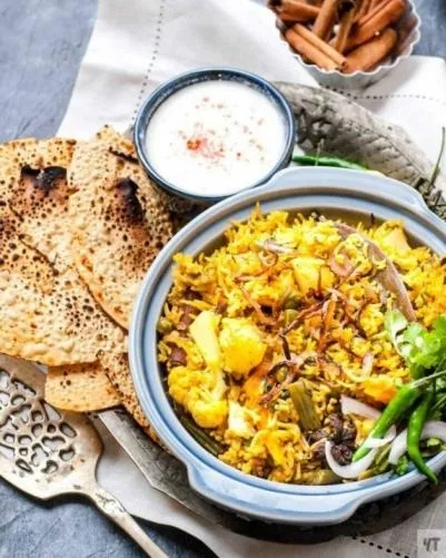 Veg Biryani (Half) + Dahi Raita + Roasted Papad