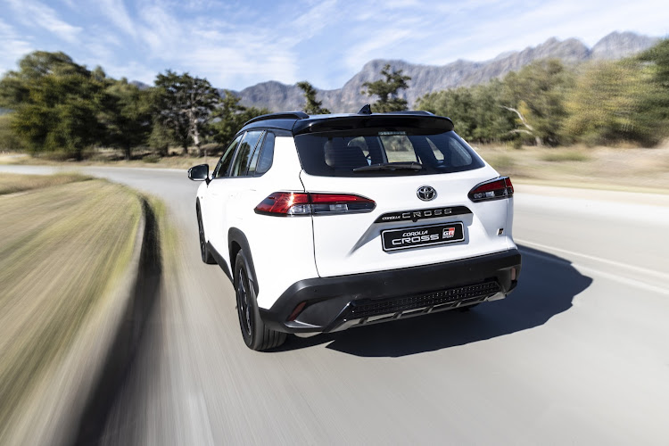 The rear has black tailgate trim and blacked-out diffuser.