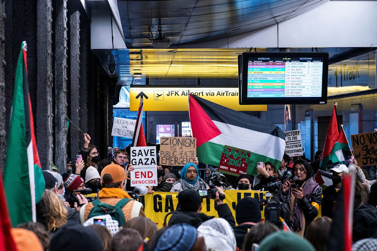 Pro-Palestinian demonstrators protest near the entrance of the Jamaica to JFK AirTrain Station in New York City, US, January 27, 2024.