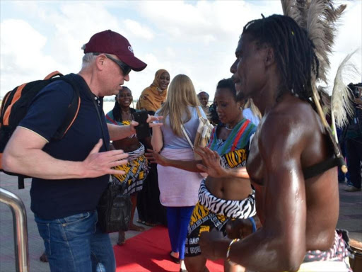 Traditional dancers welcome tourists at Moi Airport, Mombasa, when they arrived on board the inaugural Qatar Airways flight on December 9