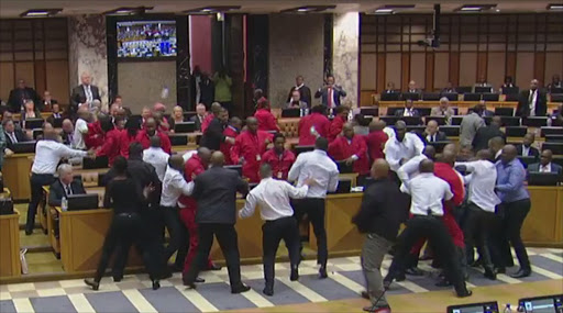 EFF MPs fight with security services who were ordered to throw them out of parliament.