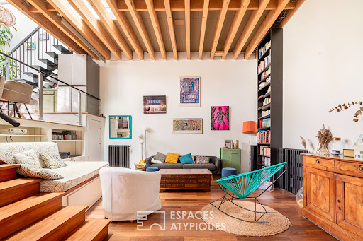 Living room with mezzanine, stairs, and bookcase - Prestige apartment / penthouse for sale in Pantin, 4 rooms, 3 bedrooms