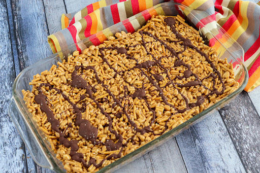 A tray of Chocolate Peanut Butter Bars ready to be sliced.