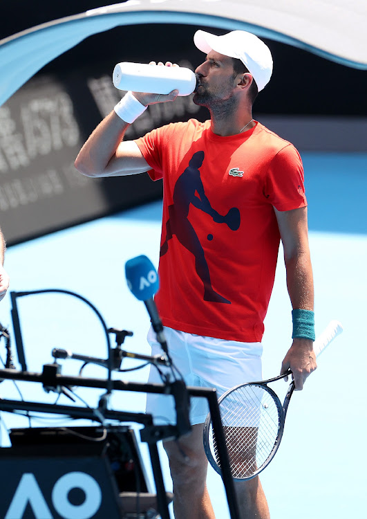 Novak Djokovic of Serbia has a drink during a training session ahead of the Australian Open at Melbourne Park on January 10, 2024