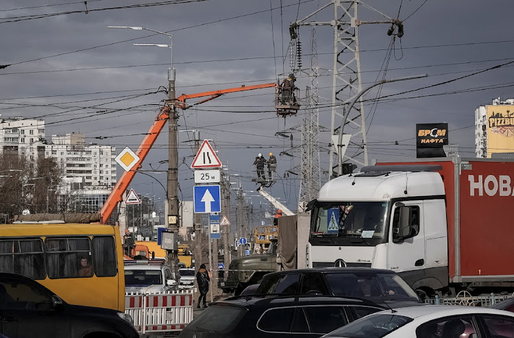 Energy supply workers restore a high-voltage line destroyed in Russian missile attack in Kyiv, Ukraine, on February 7 2024. Picture: ANNA VOITENKO/REUTERS