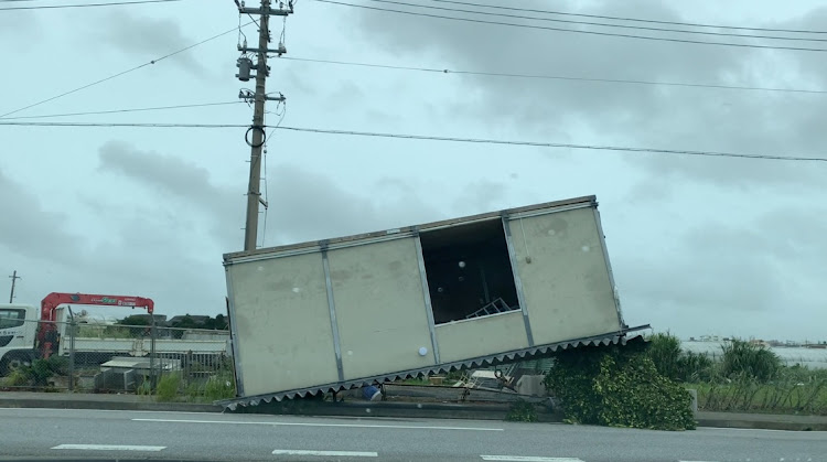 A screen grab form a handout video shows an aftermath of a typhoon along a street in Nakagami, Okinawa Prefecture, Japan, on August 3 2023. Picture: YUMA NAGAHAMA/HANDOUT via REUTERS