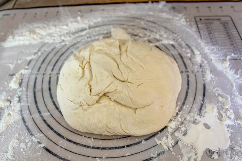 Kneading Dough On A Floured Surface.