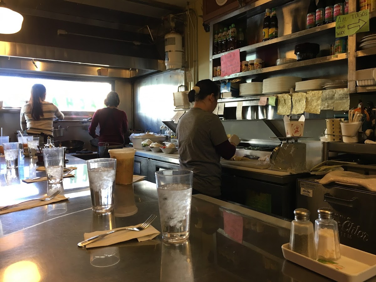 Three women work feverishly making every dish to order. Nothing is prepared ahead of time, except the rice, white or brown.