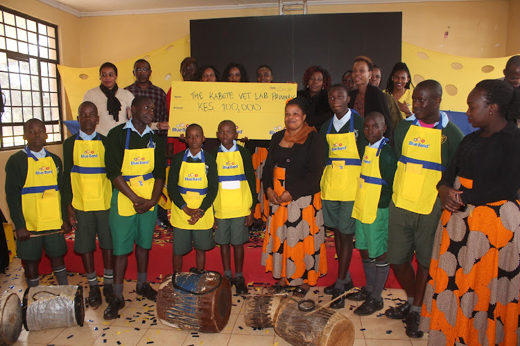 Students and teachers of Kabete Vet Lab Primary School with the Blueband team during the Good Breakfast Campaign on June 11